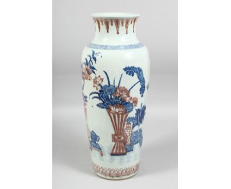 A GOOD LARGE CHINESE BLUE, WHITE, AND UNDERGLAZE RED PORCELAIN VASE in the Kangxi style, the body painted with various potted