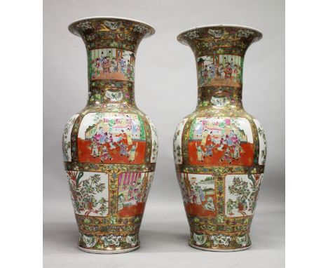 A VERY LARGE PAIR OF CHINESE CANTON FAMILLE ROSE PORCELAIN FLOOR STANDING VASES, decorated with panels of figures, birds and 