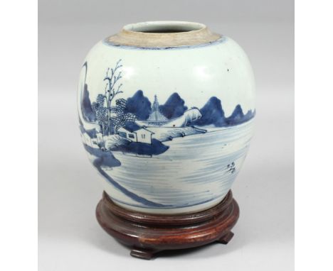 A CHINESE BLUE AND WHITE PORCELAIN JAR on a fitted hardwood stand, the body depicting a landscape scene with a lake and build