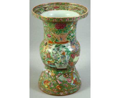 A LARGE CHINESE CANTON PORCELAIN VASE, painted with two vases depicting scenes with figures and decorated all over with flora