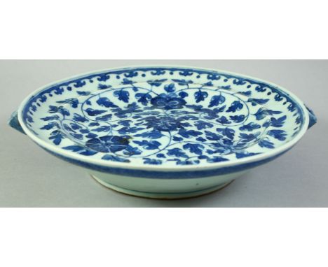 A CHINESE BLUE AND WHITE PORCELAIN WARMING DISH, possibly 18th century, with floral decoration, 28cm diameter (including spou