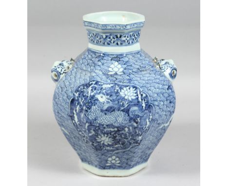 A CHINESE BLUE AND WHITE PORCELAIN OCTAGONAL TWIN-HANDLED VASE, each side decorated with a panel depicting a mythological bea