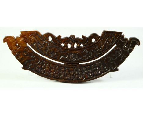 A CARVED HARDSTONE ARCHAIC AMULET, 15.5cm long.