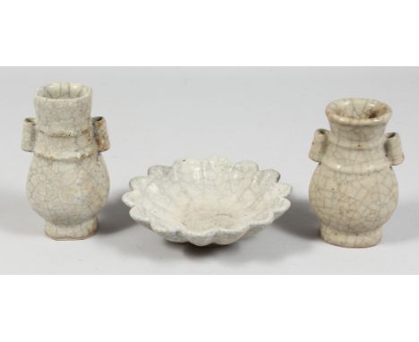 A GROUP OF THREE CRACKLE GLAZE POTTERY PIECES comprising two small arrow vases and a small ribbed bowl. Tallest vase 14cm, bo
