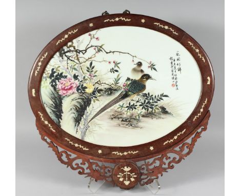 AN EARLY 20TH CENTURY CHINESE FAMILLE ROSE PORCELAIN PANEL,  encased in a bone-inlaid hardwood frame, the panel decorated wit