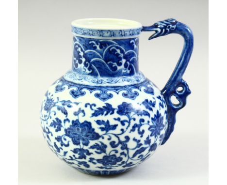 A CHINESE BLUE AND WHITE PORCELAIN JUG, the body painted with scrolling foliate decoration, the neck with a band of stylised 