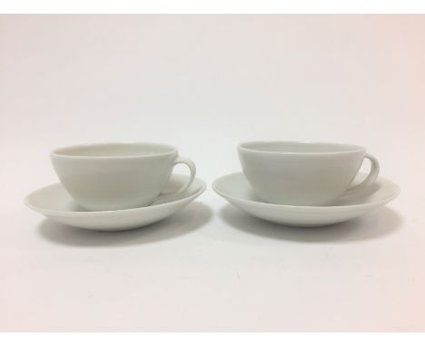 Joanna Constantinidis (British 1927-2000), two porcelain white glaze tea cups and saucers, impressed mark CONDITION REPORT: C