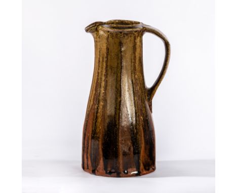 Jim Malone (British, born 1946), a cut sided jug with tenmoku glaze, 29cm high CONDITION REPORT: ARR Artist's Resale Right ma