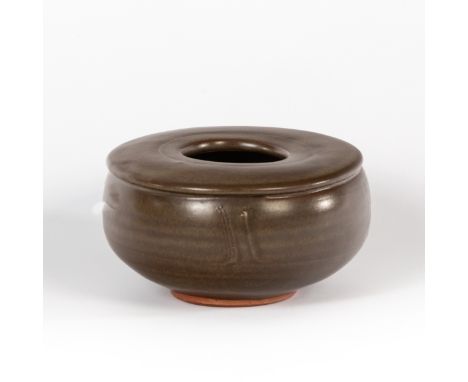 Bernard Leach (British 1887-1979), an enclosed stoneware pot, circa 1965, brown and green glazes, impressed marks, 14.5cm dia