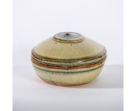 Richard Batterham (British, born 1936), a circular lidded box, of cream, celadon and blue glazes to the exterior, iron and ce