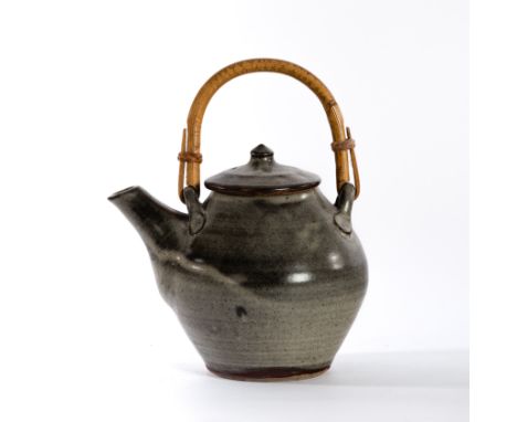 David Leach (British 1911-2005) for Lowerdown Pottery, a speckled ash glaze teapot with cane handle, 22cm high overall CONDIT