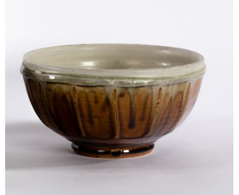 Mike Dodd, a celadon and treacle glaze stoneware bowl, 25cm diameter CONDITION REPORT: ARR Artist's Resale Right may apply to