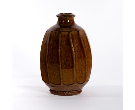 Mike Dodd (British, born 1943), a treacle glaze bottle vase with faceted sides, 24cm high CONDITION REPORT: ARR Artist's Resa