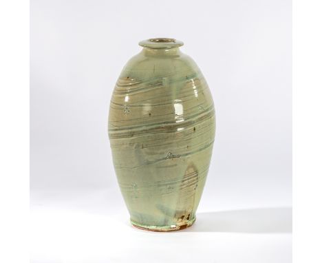 Mike Dodd (British, born 1943), a large celadon glaze bottle vase with thickly brushed hakeme glaze and occasional incised pa