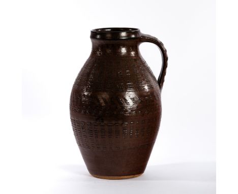 Gwyn Hanssen Pigott (Australian 1935-2013), a textured pitcher in chestnut glaze, circa 1960, 29cm high CONDITION REPORT: Goo