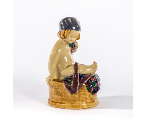 Carter Stabler Adams, a ceramic figure designed by Phoebe Stabler, 'Buster Girl', depicting a young child with flowers, grape