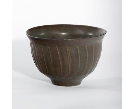 David Leach (British 1911-2005), a tenmoku glaze fluted bowl, impressed marks, 14cm diameter (crack and chips) CONDITION REPO