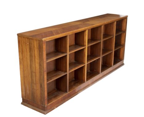 Attributed to Whytock &amp; Reid, a large double-sided padouk bookcase, the herringbone veneered top above 15 sections to eac