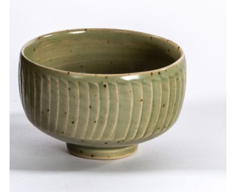 David Leach (British 1911-2005), a celadon glaze fluted footed bowl, impressed marks, 9.5cm diameter CONDITION REPORT: ARR Ar