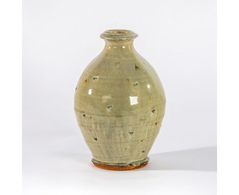 Mike Dodd (British, born 1943), a celadon glaze bottle vase with triangular cut patterns, seal mark, 23cm high CONDITION REPO