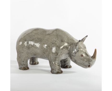 Robin Sales (British, Contemporary), a ceramic figure of a Rhino, initialled and dated 10/2000, 33cm long