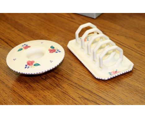Poole pottery, a mushroom posy vase, 13cm diameter and a Poole pottery toast rack, both with floral decoration