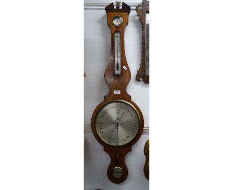 A 19th century wheel barometer with spirit level and thermometer by J Somalvico of London.