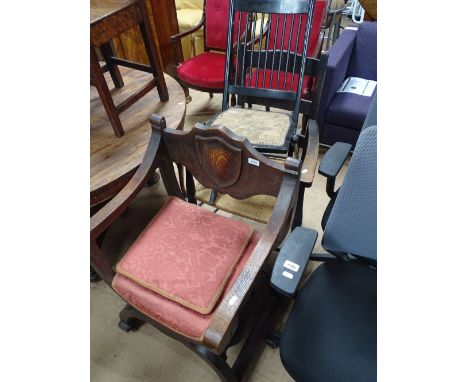 An oak X framed armchair, a ladder back rush seated elbow chair and a folding chair.