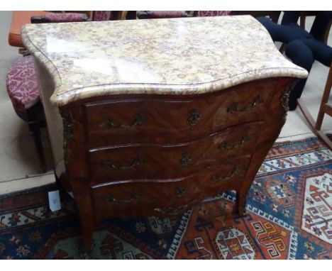 A Kingwood walnut and marquetry decorated commode of serpentine form, with shaped marble top, 3 long drawers under and ormolu