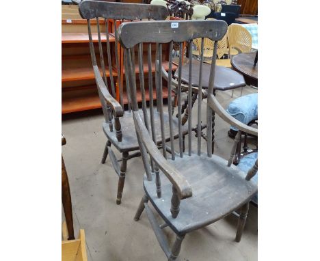 A pair of Windsor stick back kitchen chairs.