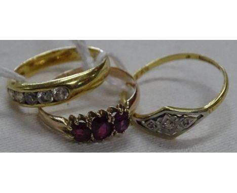 An 18ct gold 5 stone diamond ring, an 18ct gold 3 stone diamond ring and a 9ct gold 3 stone ruby ring