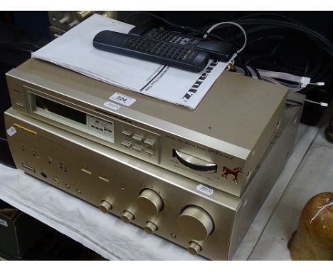 A Marantz integrated stereo amplifier and FM stereo tuner.