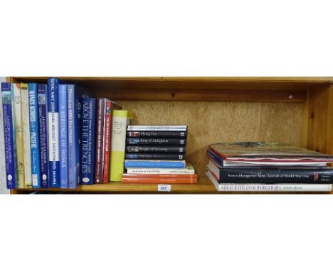A shelf of military books including Naval, World War I, etc.