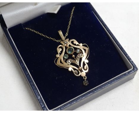 A delicate 9ct gold seed pearl and stone set pendant and chain