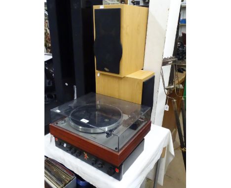A Thorens record deck, a Rotel stereo amplifier and a pair of Eltax speakers.