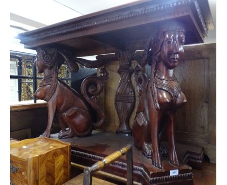 A mahogany console table with elaborately carved mythical beast supports, width 4', height 2'6".