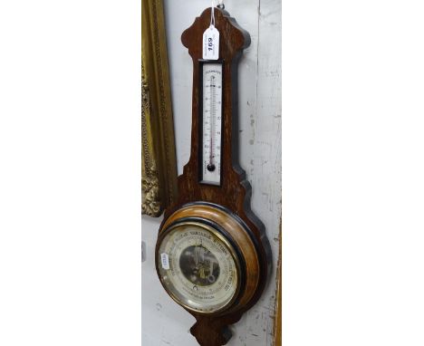 A barometer with thermometer.