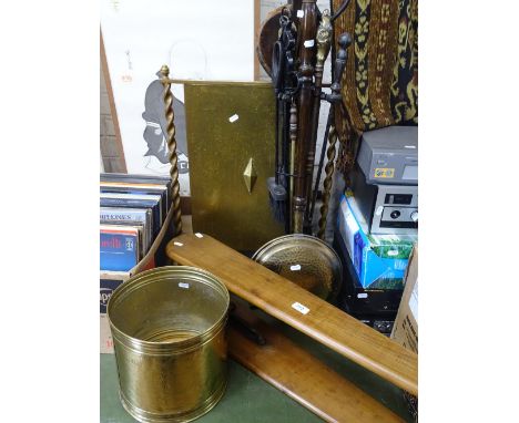 Fire irons, screen, ironing board and a bin.