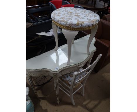 A white and gold painted serpentine console table with matching chair and stool.