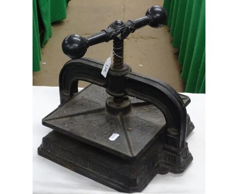 A Victorian cast-iron book press.