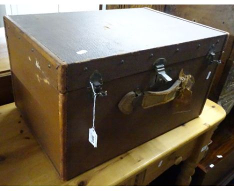 A small Vintage leather bound trunk, with label for a Lieut. Colonal C F Drew, width 1'9".