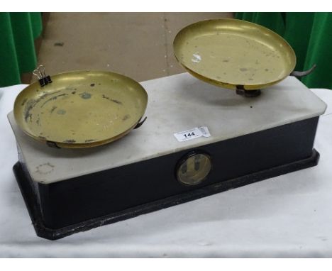 A brass pan balance scale.