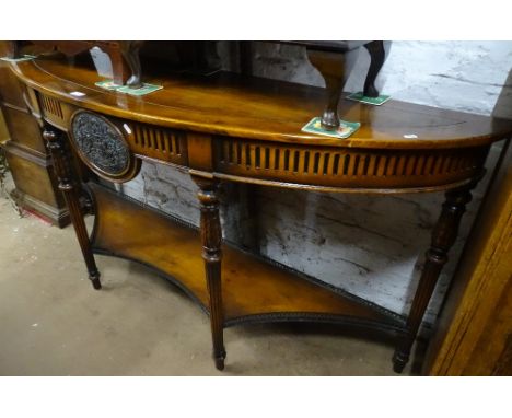 A good quality reproduction oak demi lune console table, with shaped under tier on fluted legs, length 5'10", height 2'10".