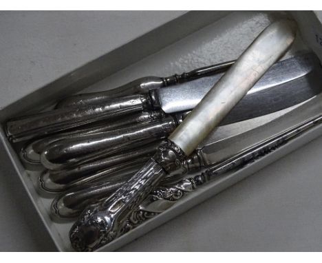 Set of 4 silver handled bread knives, another, silver handled button hooks, etc