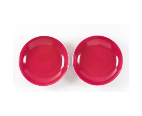 A pair of 'ruby-pink' monochrome enamelled dishesGuangxu six-character marks and of the period (1875-1908)Covered almost over