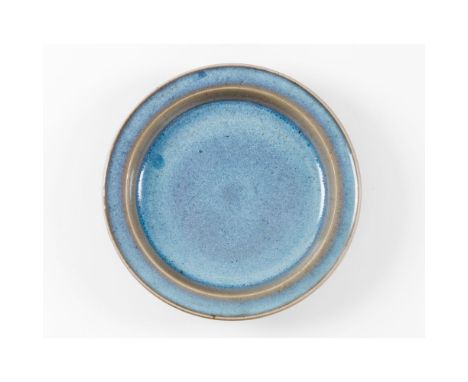 A 'Jun' sky-blue glazed dishSouthern Song Dynasty (1127-1279)Stoneware with thick sky-blue glaze, thinning to a light buff to
