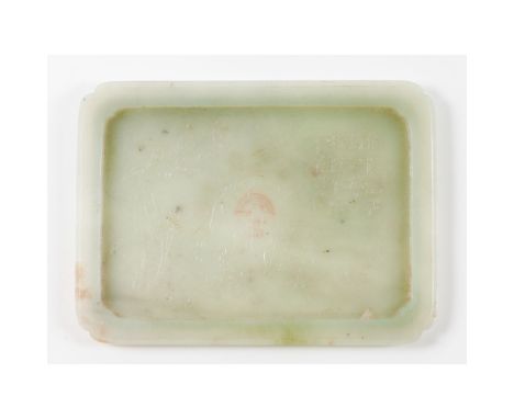 A carved jade rectangular cup stand Qing DynastyTab with canted corners Decorated on the interior in low-reliefLenght: 16 cm