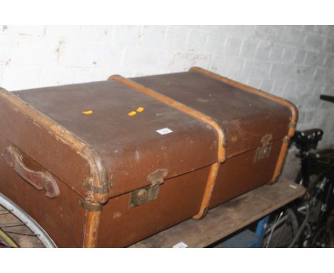 A WOOD BOUND PACKING TRUNK