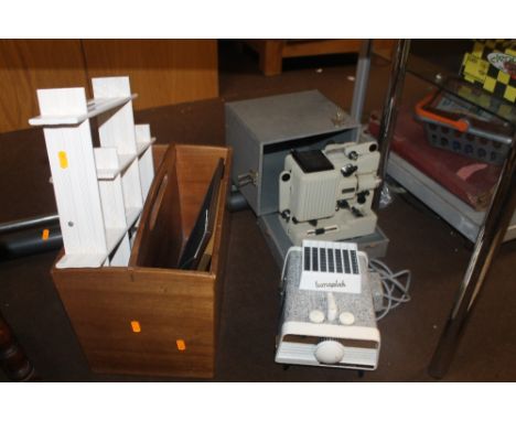 A LUMAPLAK QUARTZ LIGHT 500 35MM SLIDE VIEWER TOGETHER WITH A EUMIG SLIDE PROJECTOR AND A MAGAZINE RACK ETC 