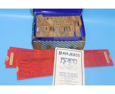 A VINTAGE MAH-JONG SET WITH SCORING CARDS AND INSTRUCTIONS 